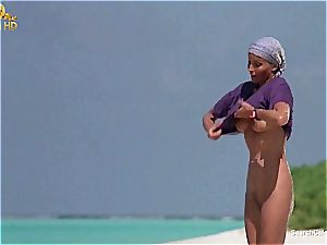 uber-sexy Bo Derek displaying off her furry puss at the beach